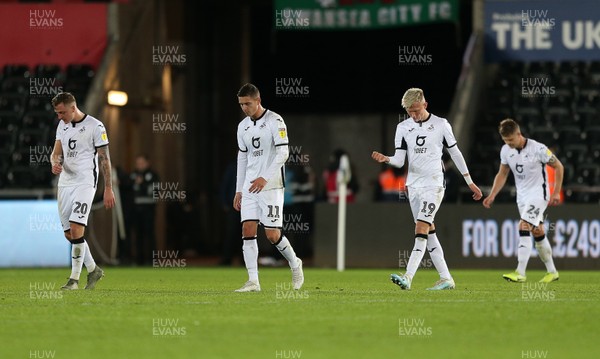 231119 - Swansea City v Millwall - SkyBet Championship - Dejected Ben Wilmot, Kristoffer Peterson and Sam Surridge and Jake Bidwell of Swansea City
