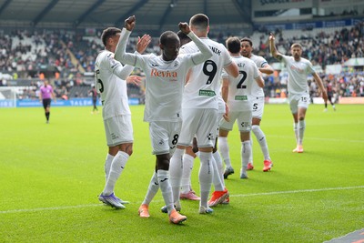 270925 - Swansea City v Millwall - Sky Bet Championship - Malick Yalcouye of Swansea City celebrates after Zan Vipotnik scores the first goal of the game