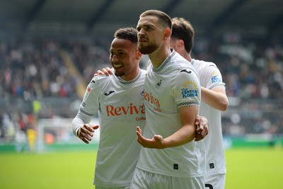 270925 - Swansea City v Millwall - Sky Bet Championship - Zan Vipotnik of Swansea City celebrates with team mates after he scores the first goal of the game
