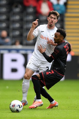 270925 - Swansea City v Millwall - Sky Bet Championship - Josh Key of Swansea City is challenged by Thierno Ballo of Millwall
