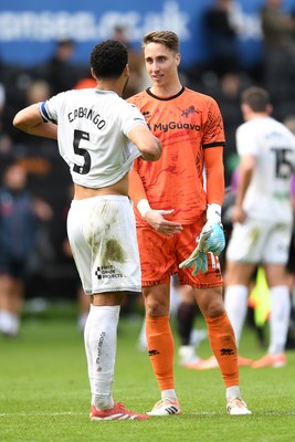 270925 - Swansea City v Millwall - Sky Bet Championship - Ben Cabango of Swansea City and Steven Benda of Millwall at full time