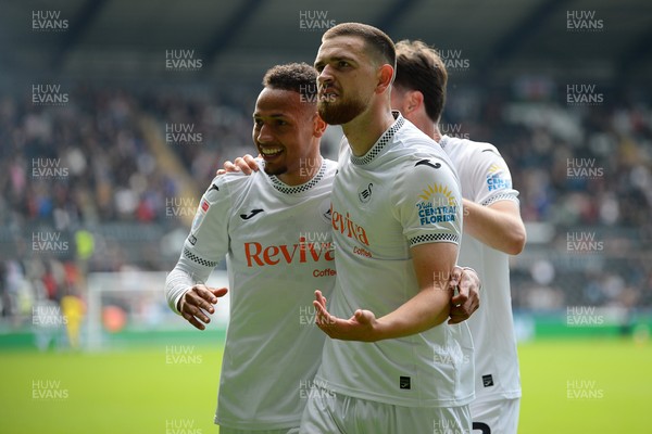 270925 - Swansea City v Millwall - Sky Bet Championship - Zan Vipotnik of Swansea City celebrates with team mates after he scores the first goal of the game