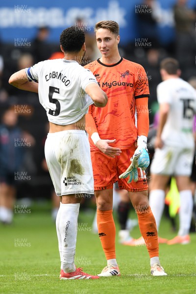 270925 - Swansea City v Millwall - Sky Bet Championship - Ben Cabango of Swansea City and Steven Benda of Millwall at full time