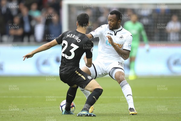 100917 - Swansea City v Newcastle United, Premier League - Jordan Ayew of Swansea City takes on Mikel Merino of Newcastle United