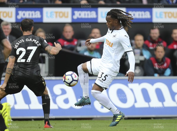 100917 - Swansea City v Newcastle United, Premier League - Renato Sanches of Swansea City controls the ball as he takes on Jesus Gamez of Newcastle United