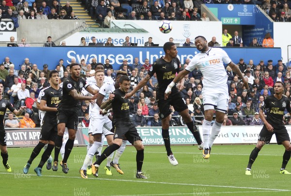 100917 - Swansea City v Newcastle United, Premier League - Jordan Ayew of Swansea City heads at goal