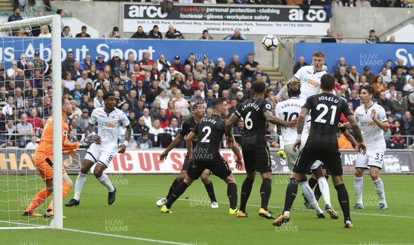 100917 - Swansea City v Newcastle United, Premier League -  Alfie Mawson of Swansea City gets above the defence to head at goal