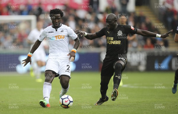 100917 - Swansea City v Newcastle United, Premier League - Wilfried Bony of Swansea City takes on Mohamed Diame of Newcastle United