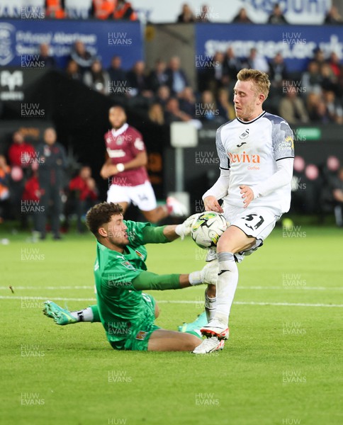 080823 - Swansea City v Northampton Town, EFL Carabao Cup - Ollie Cooper of Swansea City looks to have beaten Northampton Town goalkeeper Max Thompson but the ball goes just wide of the goal