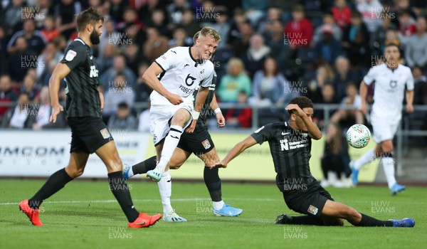 130819 - Swansea City v Northampton Town, Carabao Cup Round One - Sam Surridge of Swansea City tries to fire a shot at goal