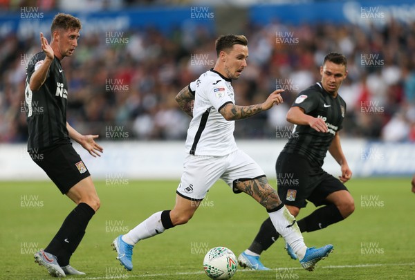 130819 - Swansea City v Northampton Town, Carabao Cup Round One - Barrie McKay of Swansea City races through the Northampton Town defence