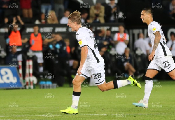 130819 - Swansea City v Northampton Town, Carabao Cup Round One - George Byers of Swansea City celebrates after he shoots to score goal
