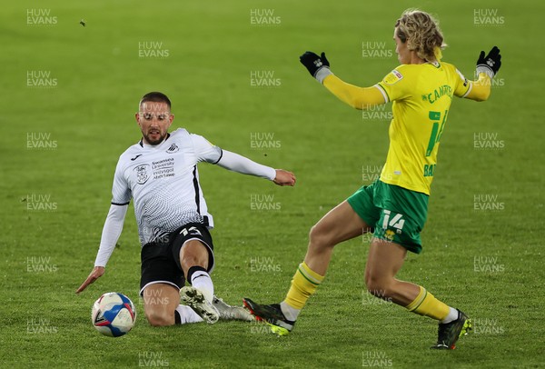 050221 - Swansea City v Norwich City - SkyBet Championship - Conor Hourihane of Swansea City is tackled by Todd Cantwell of Norwich City