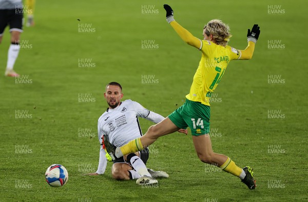 050221 - Swansea City v Norwich City - SkyBet Championship - Conor Hourihane of Swansea City is tackled by Todd Cantwell of Norwich City