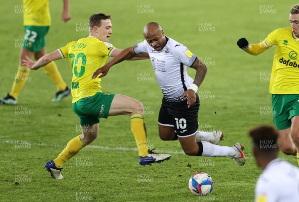 050221 - Swansea City v Norwich City - SkyBet Championship - Andre Ayew of Swansea City is tackled by Oliver Skipp of Norwich City
