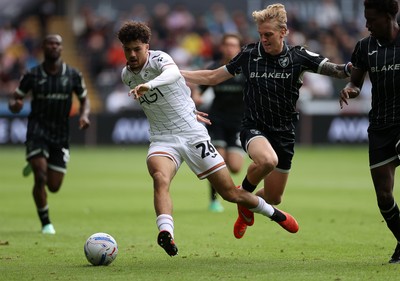 101026 - Swansea City v Norwich City - SkyBet Championship - Filip Lissah of Swansea is challenged by Pelle Mattsson of Norwich 