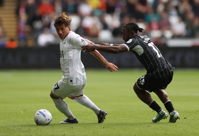 101026 - Swansea City v Norwich City - SkyBet Championship - Goncalo Franco of Swansea is challenged by Darlin Yongwa of Norwich 