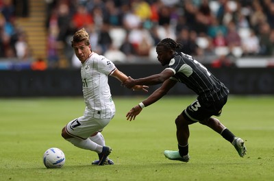 101026 - Swansea City v Norwich City - SkyBet Championship - Goncalo Franco of Swansea is challenged by Darlin Yongwa of Norwich 