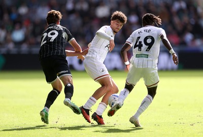 101026 - Swansea City v Norwich City - SkyBet Championship - Filip Lissah of Swansea is challenged by Oscar Schwartau of Norwich 