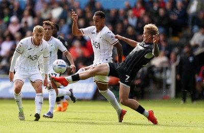 101026 - Swansea City v Norwich City - SkyBet Championship - Adam Idah of Swansea is tackled by Pelle Mattsson of Norwich 
