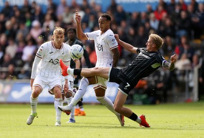 101026 - Swansea City v Norwich City - SkyBet Championship - Adam Idah of Swansea is tackled by Pelle Mattsson of Norwich 