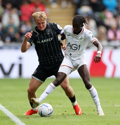 101026 - Swansea City v Norwich City - SkyBet Championship - Pelle Mattsson of Norwich is tackled by Moussa Yeo of Swansea 