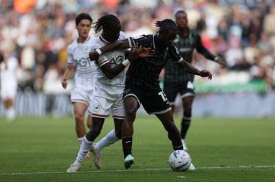 101026 - Swansea City v Norwich City - SkyBet Championship - Moussa Yeo of Swansea is tackled by Darlin Yongwa of Norwich 