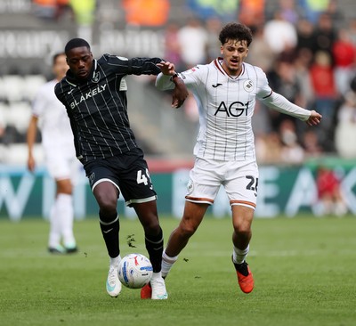 101026 - Swansea City v Norwich City - SkyBet Championship - Filip Lissah of Swansea is tackled by Anthony Musaba of Norwich 