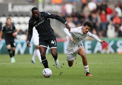 101026 - Swansea City v Norwich City - SkyBet Championship - Filip Lissah of Swansea is tackled by Anthony Musaba of Norwich 