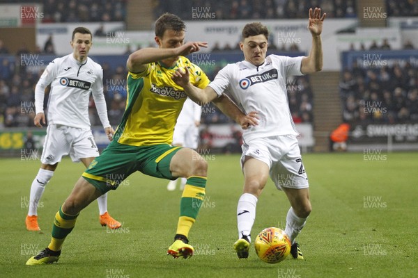 241118 - Swansea City v Norwich City, EFL Championship - Daniel James of Swansea City (right) in action with  Christoph Zimmermann of Norwich City