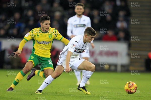 241118 - Swansea City v Norwich City, EFL Championship - Daniel James of Swansea City (right) in action with Emi Buendia of Norwich City
