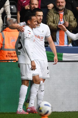 251025 - Swansea City v Norwich City - Sky Bet Championship - Zan Vipotnik of Swansea City celebrates scoring a goal with team mates