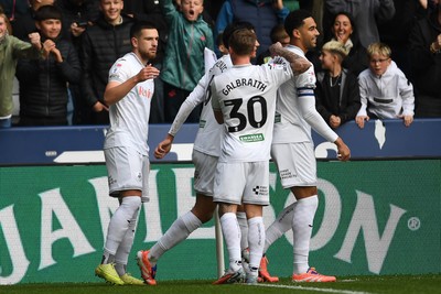 251025 - Swansea City v Norwich City - Sky Bet Championship - Zan Vipotnik of Swansea City celebrates scoring a goal with team mates