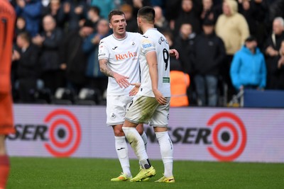 251025 - Swansea City v Norwich City - Sky Bet Championship - Zan Vipotnik of Swansea City celebrates scoring a goal with team mates