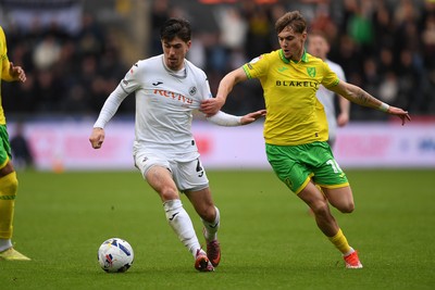 251025 - Swansea City v Norwich City - Sky Bet Championship - Josh Key of Swansea City is challenged by Jacob Wright of Norwich