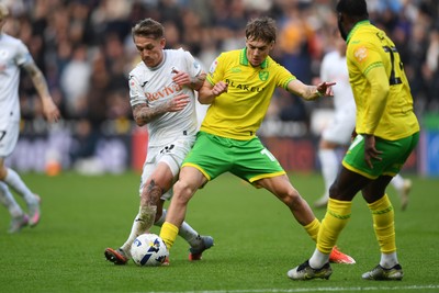 251025 - Swansea City v Norwich City - Sky Bet Championship - Ethan Galbraith of Swansea City is challenged by Jacob Wright of Norwich