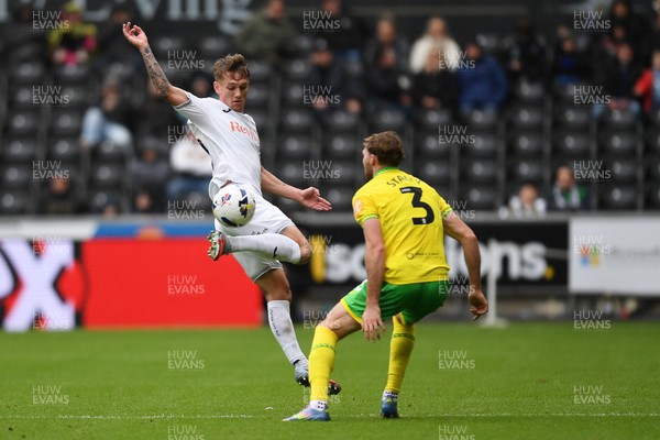 251025 - Swansea City v Norwich City - Sky Bet Championship - Ethan Galbraith of Swansea City is challenged by Jack Stacey of Norwich