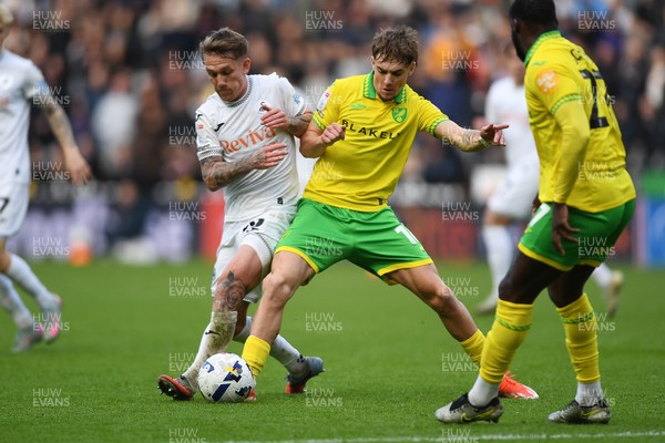 251025 - Swansea City v Norwich City - Sky Bet Championship - Ethan Galbraith of Swansea City is challenged by Jacob Wright of Norwich