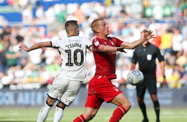140919 - Swansea City v Nottingham Forest, SkyBet Championship - Ben Watson of Nottingham Forest and Bersant Celina of Swansea City compete for the ball