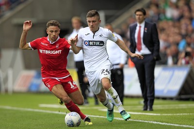 150918- Swansea City v Nottingham Forest, EFL Championship - Declan John of Swansea City (right) takes on Matty Cash of Nottingham Forest