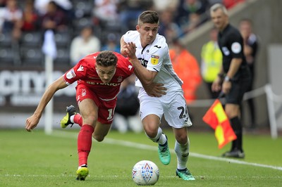 150918- Swansea City v Nottingham Forest, EFL Championship - Declan John of Swansea City (right) in action with Matty Cash of Nottingham Forest