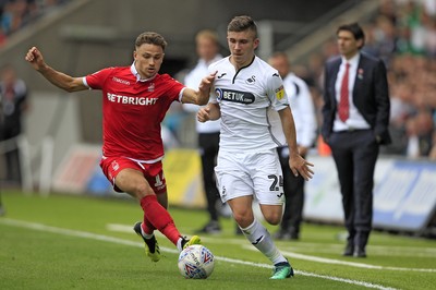 150918- Swansea City v Nottingham Forest, EFL Championship - Declan John of Swansea City (right) in action with Matty Cash of Nottingham Forest