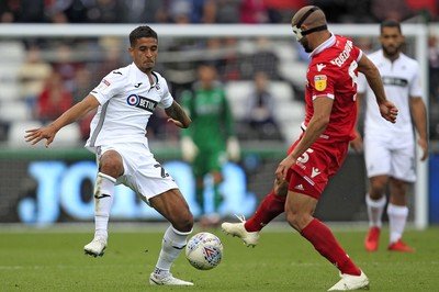 150918- Swansea City v Nottingham Forest, EFL Championship - Kyle Naughton of Swansea City (left) in action with Adlene Guedioura of Nottingham Forest