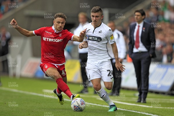 150918- Swansea City v Nottingham Forest, EFL Championship - Declan John of Swansea City (right) in action with Matty Cash of Nottingham Forest