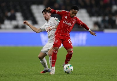 170925 - Swansea City v Nottingham Forest - Carabao Cup - Omari Hutchinson of Nottingham Forest is tackled by Josh Key of Swansea City 