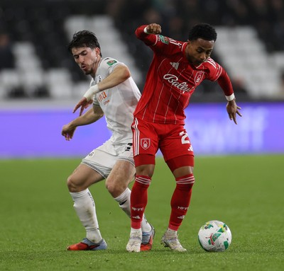 170925 - Swansea City v Nottingham Forest - Carabao Cup - Omari Hutchinson of Nottingham Forest is tackled by Josh Key of Swansea City 