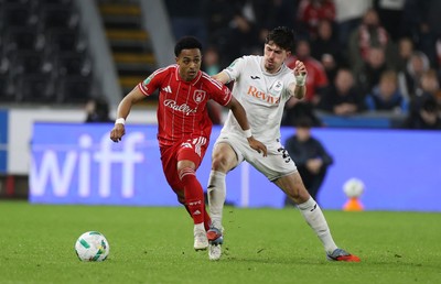 170925 - Swansea City v Nottingham Forest - Carabao Cup - Omari Hutchinson of Nottingham Forest is challenged by Josh Key of Swansea City 