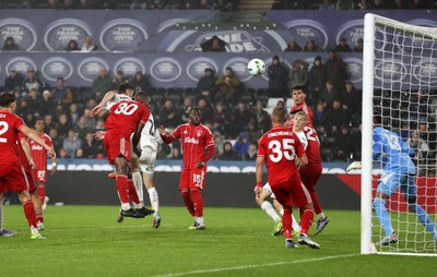 170925 - Swansea City v Nottingham Forest - Carabao Cup - Cameron Burgess of Swansea City headers the ball to score a goal