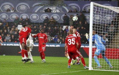 170925 - Swansea City v Nottingham Forest - Carabao Cup - Cameron Burgess of Swansea City headers the ball to score a goal