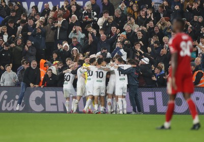 170925 - Swansea City v Nottingham Forest - Carabao Cup - Cameron Burgess of Swansea City and team mates celebrate with fans after he scored their winning goal